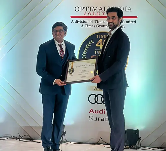 Doctor receiving Times 40 Under 40 award