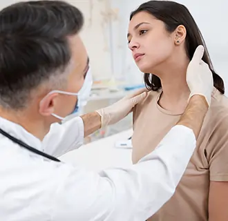 Head and neck cancer specialist performing neck examination